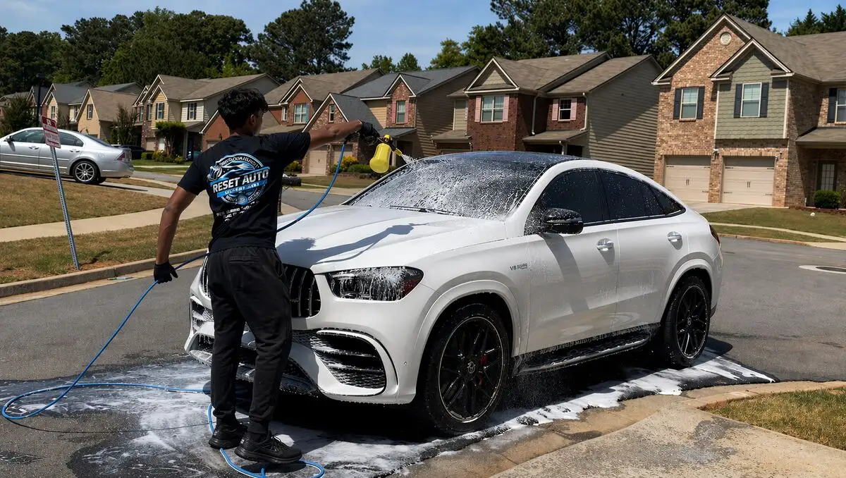 Reset Auto Detailing technician hand-washing a vehicle on-site in Gwinnett County